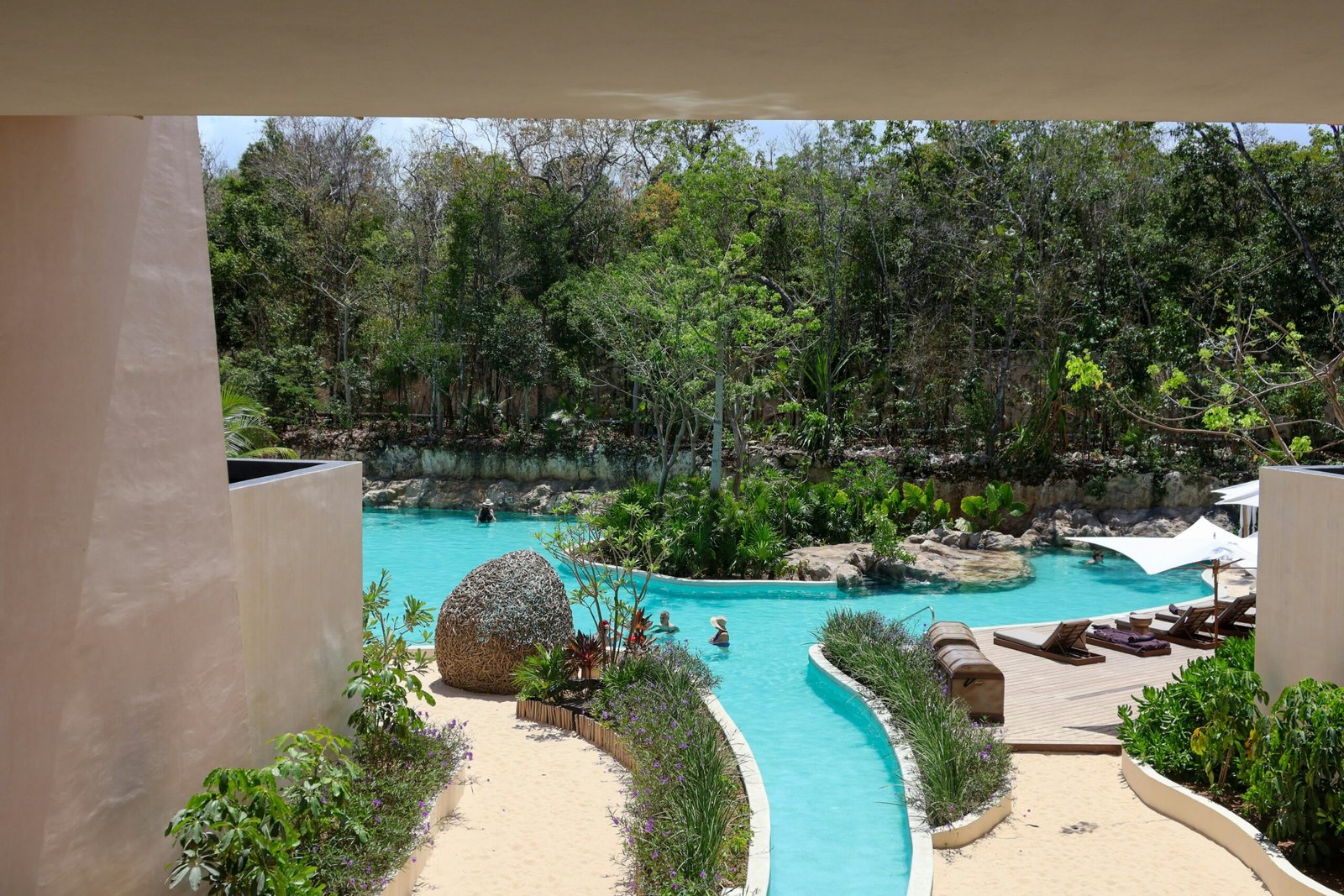 a view of a pool from inside a building